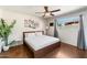 Inviting bedroom with natural light, ceiling fan, modern decor, and a relaxing atmosphere at 7326 E Portland St, Scottsdale, AZ 85257