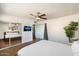 Spacious bedroom with ceiling fan, neutral tones, and a large closet and door to outdoor patio at 7326 E Portland St, Scottsdale, AZ 85257