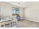Well-lit bedroom with a window view, carpet flooring, and a white bed frame, creating a comfortable space at 7528 E Peralta Ave, Mesa, AZ 85212