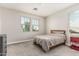 Neutral toned bedroom with carpet and a wooden bed frame, as well as two windows with light-filtering blinds at 7528 E Peralta Ave, Mesa, AZ 85212