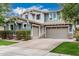 Charming home with a three-car garage, stone accents, and a well-maintained yard at 7528 E Peralta Ave, Mesa, AZ 85212