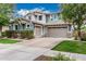 Beautiful two-story home featuring a three-car garage and manicured front lawn at 7528 E Peralta Ave, Mesa, AZ 85212
