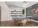 Spacious game room with a ping pong table and stylish decor on wood floors at 7528 E Peralta Ave, Mesa, AZ 85212