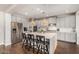 This spacious kitchen features gray cabinets, a center island, and modern stainless steel appliances at 7528 E Peralta Ave, Mesa, AZ 85212