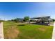 A grassy park with multiple covered picnic and playground areas for community enjoyment at 7528 E Peralta Ave, Mesa, AZ 85212
