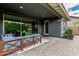 Relaxing outdoor patio with comfortable seating and scenic views of the spacious backyard and landscaping at 7528 E Peralta Ave, Mesa, AZ 85212