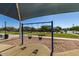 Community swing set area, located in a sanded area, with a view of residential homes at 7528 E Peralta Ave, Mesa, AZ 85212