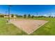 Well-kept sand volleyball court in a sunny community park with lighting for evening play at 7528 E Peralta Ave, Mesa, AZ 85212