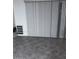 Bedroom featuring neutral walls, tile floors, and vertical blinds at 8055 E Thomas Rd # H103, Scottsdale, AZ 85251