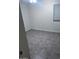 Empty bedroom featuring tiled flooring, light walls, and window at 8055 E Thomas Rd # H103, Scottsdale, AZ 85251