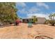 Expansive backyard with decorative landscaping features and a covered patio perfect for outdoor enjoyment at 8302 E Dutchman Dr, Mesa, AZ 85208
