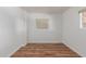 Bedroom with window and wood floors at 8302 E Dutchman Dr, Mesa, AZ 85208