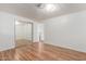 This bedroom features wood floors and mirrored closet doors at 8302 E Dutchman Dr, Mesa, AZ 85208