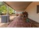 Extended covered patio featuring tile flooring, offering ample space for relaxing and leisure at 8302 E Dutchman Dr, Mesa, AZ 85208