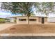 Charming single-story home with well-maintained landscaping and covered parking at 8302 E Dutchman Dr, Mesa, AZ 85208