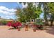 Charming front yard featuring vibrant flowers and decorative accents at 8302 E Dutchman Dr, Mesa, AZ 85208