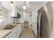 Functional kitchen featuring white cabinetry and stainless steel appliances at 8302 E Dutchman Dr, Mesa, AZ 85208