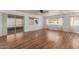 Spacious living room with sleek laminate flooring and abundant natural light at 8302 E Dutchman Dr, Mesa, AZ 85208