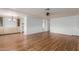Bright living space with laminate flooring and seamless transition to dining area at 8302 E Dutchman Dr, Mesa, AZ 85208