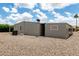 Back of the property with a low maintenance desert landscape and views of surrounding blue skies at 8330 E Pueblo Ave, Mesa, AZ 85208
