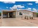 Home featuring low-maintenance gravel landscaping and covered carport for convenient parking at 8330 E Pueblo Ave, Mesa, AZ 85208