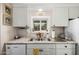 Kitchen area with granite countertops, stainless appliances, and white cabinets at 8330 E Pueblo Ave, Mesa, AZ 85208