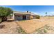 Spacious backyard with room for entertaining and relaxing with a covered patio area and potential for landscaping at 8703 W Golden Ln, Peoria, AZ 85345