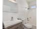 Bathroom featuring a modern sink, mirror, toilet, and shower at 8703 W Golden Ln, Peoria, AZ 85345