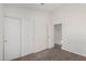 Carpeted bedroom with closet and bright white walls for a clean look at 8703 W Golden Ln, Peoria, AZ 85345