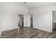Spacious bedroom with wood-look floors, closet and connected bathroom at 8703 W Golden Ln, Peoria, AZ 85345