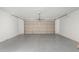 Spacious garage with an automatic door and epoxy flooring at 8703 W Golden Ln, Peoria, AZ 85345