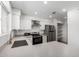 Modern kitchen featuring stainless steel appliances, ample counter space, and updated fixtures at 8703 W Golden Ln, Peoria, AZ 85345