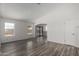 Open and airy living room with modern wood flooring and plenty of natural light at 8703 W Golden Ln, Peoria, AZ 85345