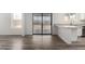 Open living space with wood-look floors and sliding doors for easy outdoor access at 8703 W Golden Ln, Peoria, AZ 85345