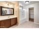 Spacious bathroom featuring double sinks and tub/shower combo with tile flooring at 9 N 87Th N Ln, Tolleson, AZ 85353