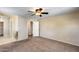 Spacious carpeted bedroom with adjoining bathroom and walk-in closet at 9 N 87Th N Ln, Tolleson, AZ 85353