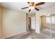 Bedroom featuring closet with mirrored doors and carpet at 9 N 87Th N Ln, Tolleson, AZ 85353