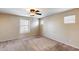Carpeted bedroom with ceiling fan and neutral walls and trim at 9 N 87Th N Ln, Tolleson, AZ 85353
