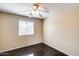 Bedroom with wood floors and ceiling fan at 9 N 87Th N Ln, Tolleson, AZ 85353