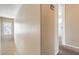 Hallway with neutral carpet and paint leading to bedroom at 9 N 87Th N Ln, Tolleson, AZ 85353