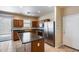 Kitchen featuring stainless steel appliances and a center island for food preparation and casual dining at 9 N 87Th N Ln, Tolleson, AZ 85353