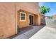 Exterior patio featuring brick accents with a sliding glass door, perfect for relaxation and entertainment at 9 N 87Th N Ln, Tolleson, AZ 85353