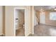 Powder room conveniently located off the entry way with tiled floors and a white pedestal sink at 9 N 87Th N Ln, Tolleson, AZ 85353