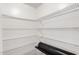 Spacious walk-in closet with ample shelving for optimal storage at 9 N 87Th N Ln, Tolleson, AZ 85353