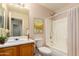 A well-lit bathroom featuring a vanity and a bathtub with shower at 9332 W Mary Ann Dr, Peoria, AZ 85382