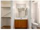 This bathroom has a roomy walk in closet, perfect lighting and a vanity with storage at 9332 W Mary Ann Dr, Peoria, AZ 85382