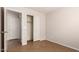 An unfurnished bedroom featuring a closet and a doorway to a bathroom at 9332 W Mary Ann Dr, Peoria, AZ 85382