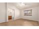 A bright bedroom with a window letting in natural light and a ceiling fan for comfortable living at 9332 W Mary Ann Dr, Peoria, AZ 85382