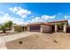Attractive single-story home featuring a tile roof, gravel landscaping, and a two-car garage at 9332 W Mary Ann Dr, Peoria, AZ 85382