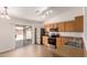 Eat-in kitchen featuring stainless appliances, wood cabinets, and sliding doors to the backyard at 9332 W Mary Ann Dr, Peoria, AZ 85382